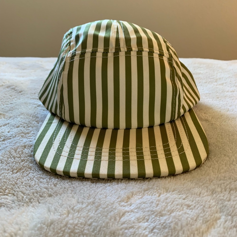 Adorable green and cream stripe Twill and Pine flat brim panel hat for toddlers.